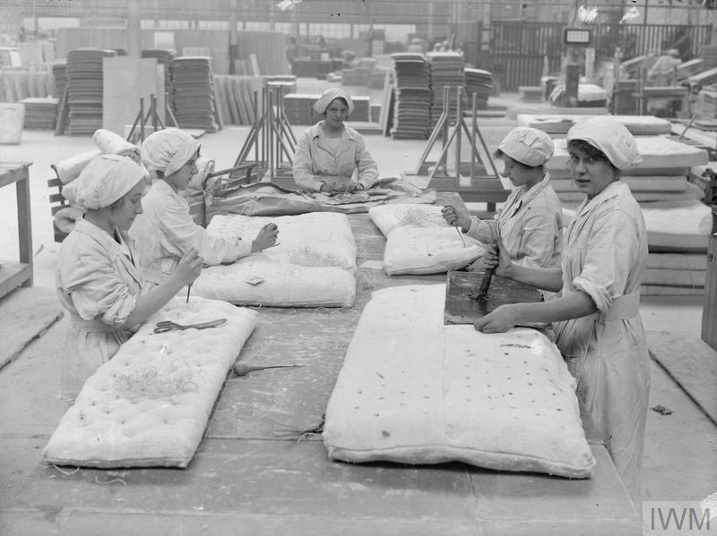 women working in an asbestos production factory during WWII