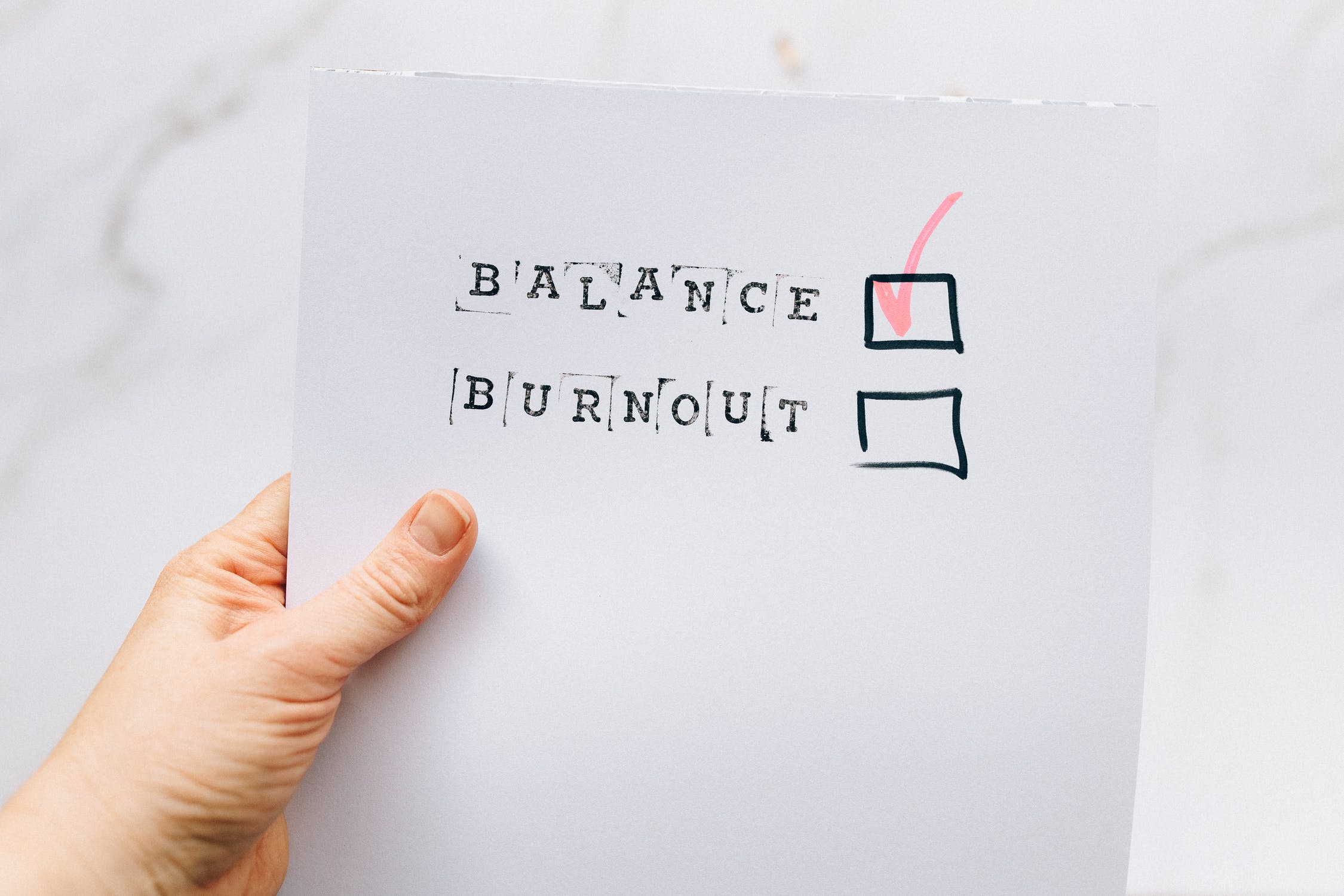 sheet of paper saying to choose balance not burnout