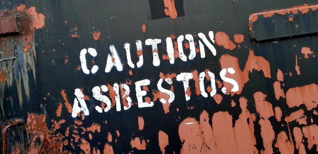sign saying caution asbestos
